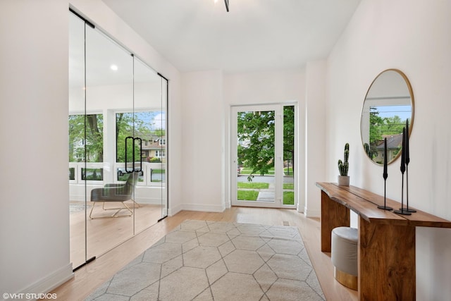 6947 N Overhill Ave, Chicago, IL 60631 - foyer entrance featuring light wood-style floors and baseboards