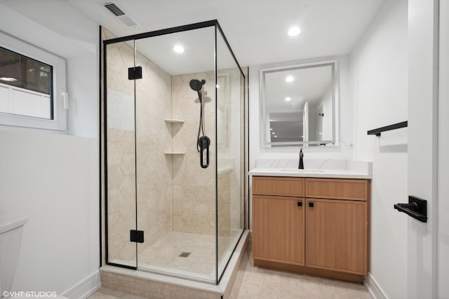 6947 N Overhill Ave, Chicago, IL 60631 - full bath with vanity, toilet, baseboards, recessed lighting, and a stall shower