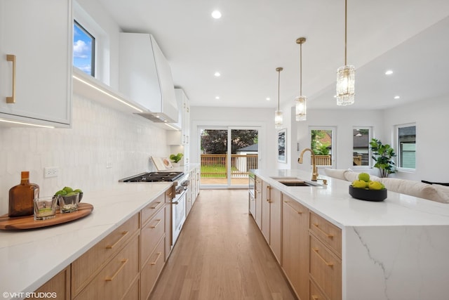 6947 N Overhill Ave, Chicago, IL 60631 - kitchen with a sink, light brown cabinets, light wood-style flooring, recessed lighting, and light stone countertops