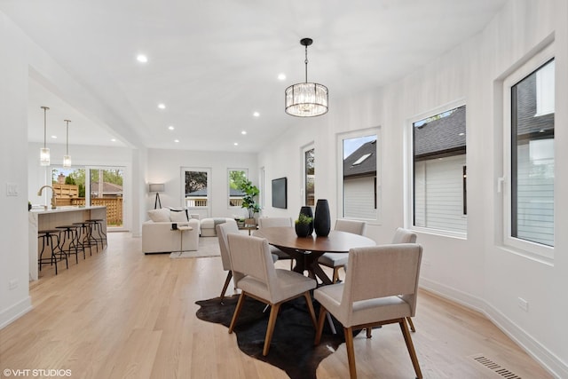 6947 N Overhill Ave, Chicago, IL 60631 - dining space featuring light wood-style flooring, baseboards, recessed lighting, and a chandelier