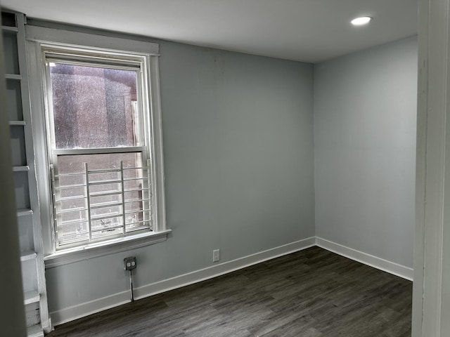 7621 S Eberhart Ave, Chicago, IL 60619 - empty room featuring dark wood-style flooring, baseboards, and recessed lighting