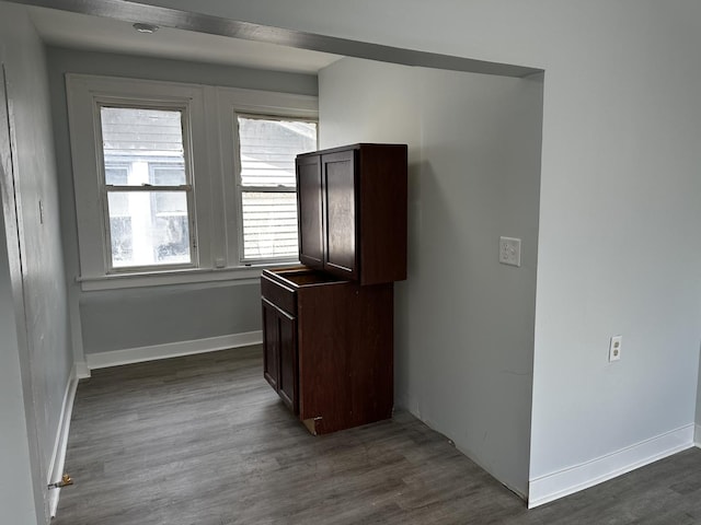 7621 S Eberhart Ave, Chicago, IL 60619 - kitchen featuring dark brown cabinetry, dark wood finished floors, and baseboards