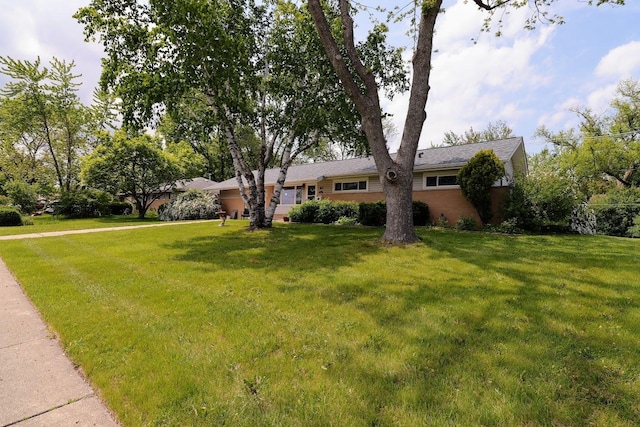 80 Flagstaff Ln, Hoffman Estates, IL 60169 - view of front facade with a front yard and brick siding