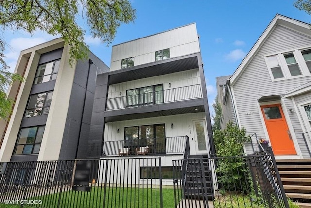2633 N Emmett St Unit 1F, Chicago, IL 60647 - view of front of property with a balcony, stairs, and a porch
