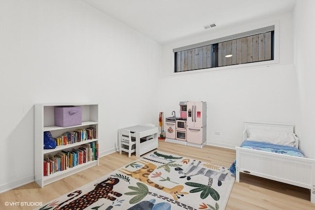 2633 N Emmett St Unit 1F, Chicago, IL 60647 - bedroom with wood finished floors and baseboards
