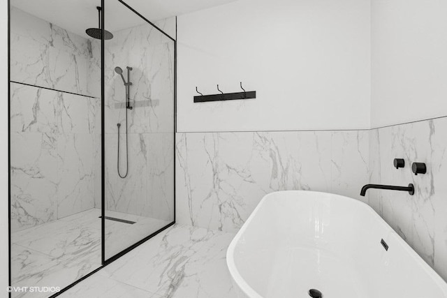 2633 N Emmett St Unit 1F, Chicago, IL 60647 - full bathroom featuring a soaking tub and a marble finish shower