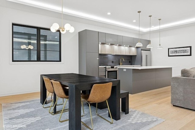 2633 N Emmett St Unit 1F, Chicago, IL 60647 - dining area with light wood finished floors, recessed lighting, and a raised ceiling