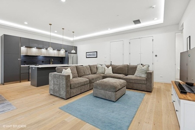 2633 N Emmett St Unit 1F, Chicago, IL 60647 - living area with a raised ceiling, light wood-style flooring, and recessed lighting
