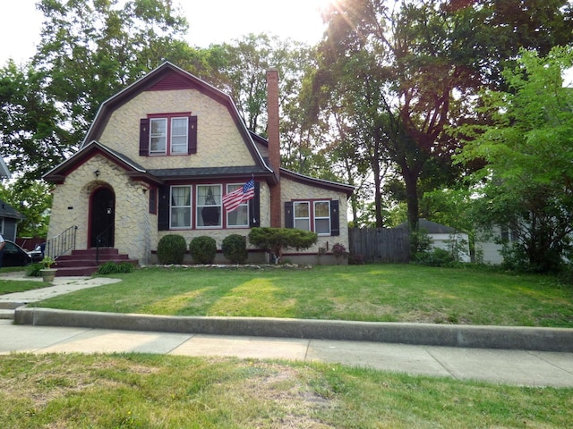 21 Woodland Ave, Elgin, IL 60123 - dutch colonial with a gambrel roof, a chimney, and stone siding