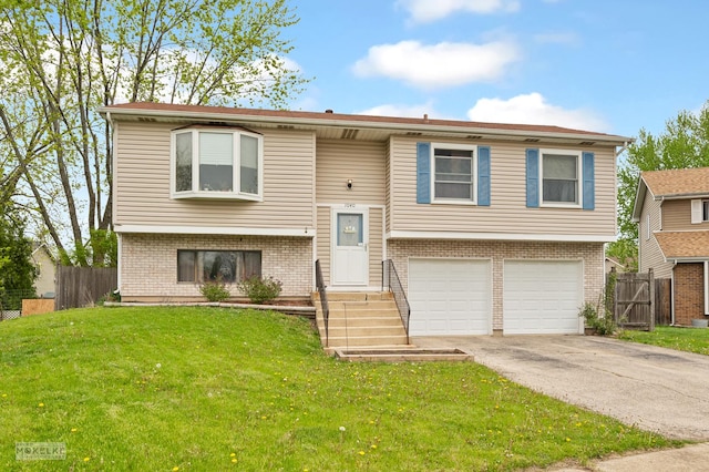 1040 Dover Ln, Aurora, IL 60504 - bi-level home with a garage, driveway, and brick siding