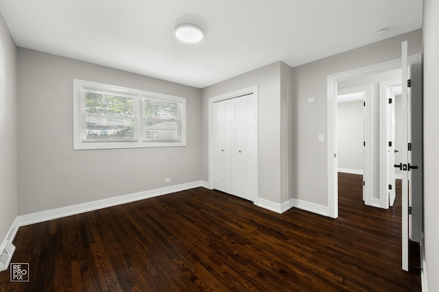 1166 S Highland Ave, Arlington Heights, IL 60005 - unfurnished bedroom with dark wood finished floors, baseboards, and a closet