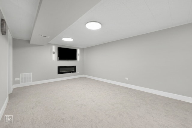 1166 S Highland Ave, Arlington Heights, IL 60005 - finished basement featuring carpet, a glass covered fireplace, and baseboards