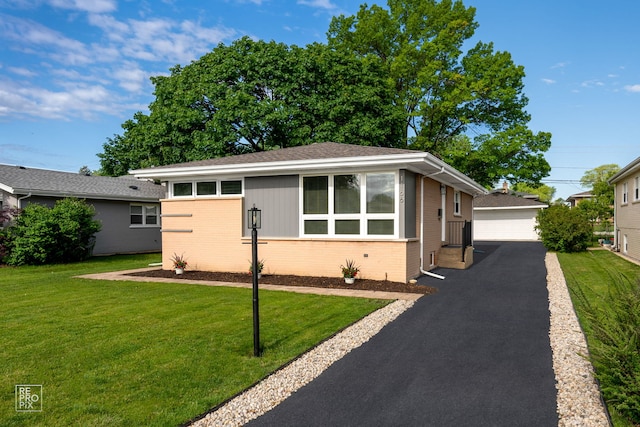 1166 S Highland Ave, Arlington Heights, IL 60005 - view of front of property featuring brick siding, a detached garage, an outbuilding, a front lawn, and entry steps