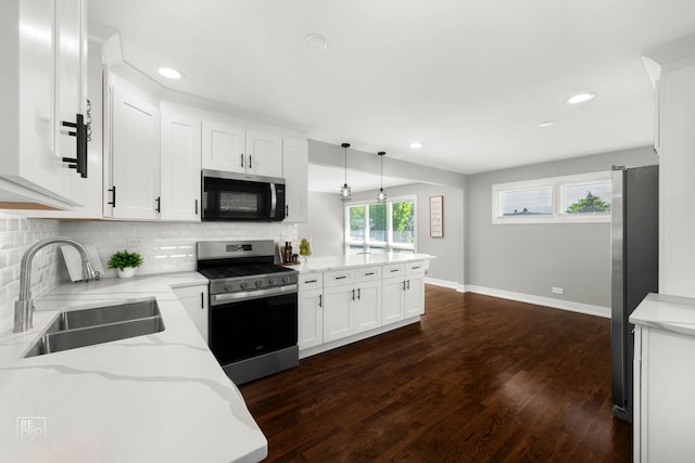 1166 S Highland Ave, Arlington Heights, IL 60005 - kitchen featuring appliances with stainless steel finishes, a sink, tasteful backsplash, white cabinets, and dark wood-style flooring