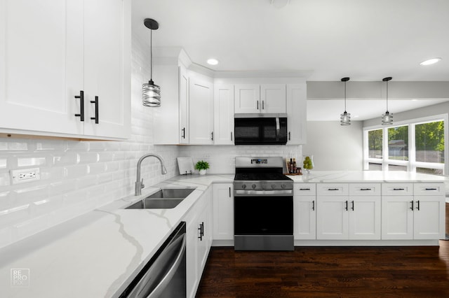 1166 S Highland Ave, Arlington Heights, IL 60005 - kitchen featuring stainless steel appliances, a sink, a peninsula, recessed lighting, and white cabinets