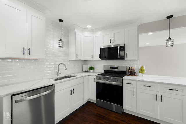1166 S Highland Ave, Arlington Heights, IL 60005 - kitchen with stainless steel appliances, a sink, tasteful backsplash, dark wood finished floors, and white cabinets