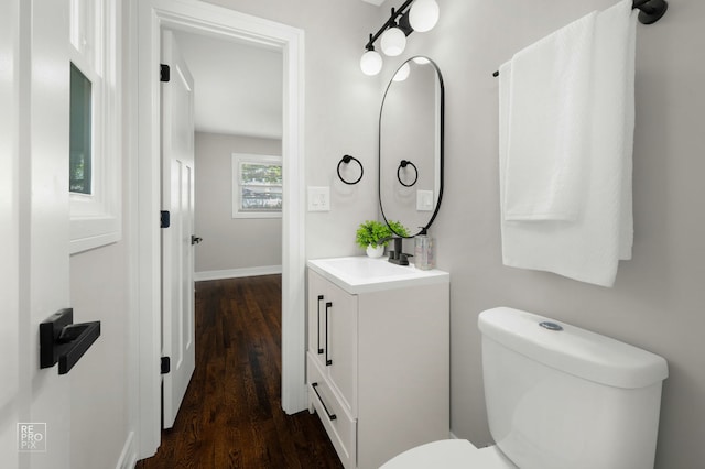 1166 S Highland Ave, Arlington Heights, IL 60005 - bathroom featuring vanity, toilet, wood finished floors, and baseboards