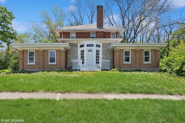 1005 Division St, Lisle, IL 60532 - view of front facade featuring a chimney, brick siding, a front yard, and stone siding