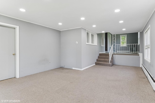 1005 Division St, Lisle, IL 60532 - empty room featuring a baseboard heating unit, recessed lighting, carpet flooring, and stairs