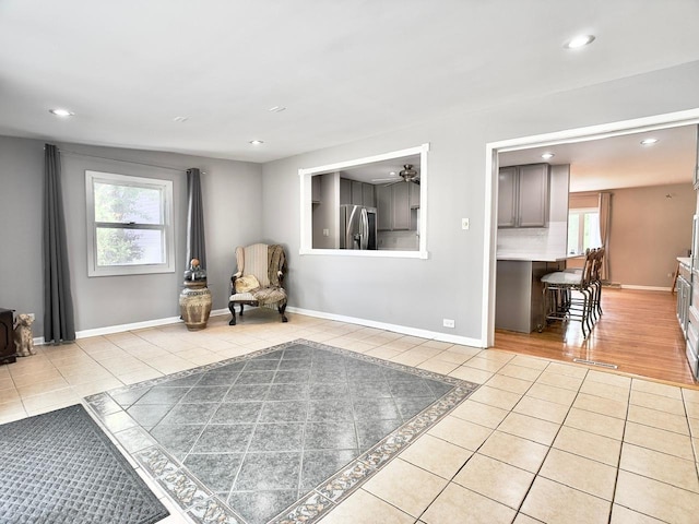 9113 Elm Cir, Hickory Hills, IL 60457 - living area with light tile patterned floors, healthy amount of natural light, recessed lighting, a ceiling fan, and baseboards