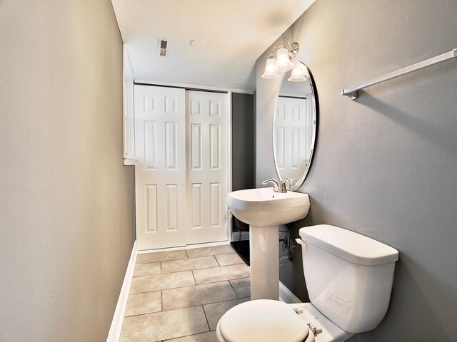 9113 Elm Cir, Hickory Hills, IL 60457 - bathroom with toilet, baseboards, and tile patterned floors
