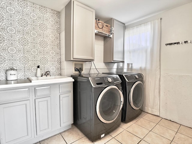 9113 Elm Cir, Hickory Hills, IL 60457 - laundry room featuring washing machine and dryer, cabinet space, and light tile patterned floors