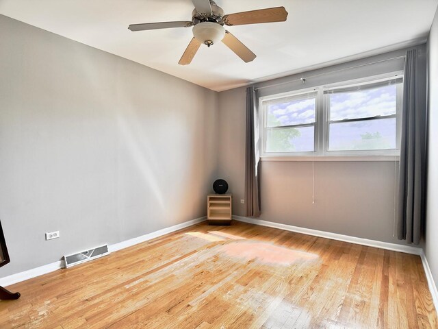 9113 Elm Cir, Hickory Hills, IL 60457 - empty room with wood finished floors, baseboards, and a ceiling fan