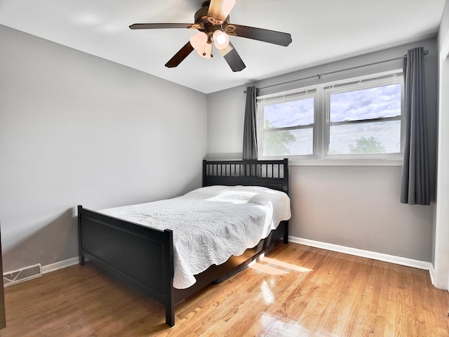 9113 Elm Cir, Hickory Hills, IL 60457 - bedroom with baseboards, wood finished floors, and a ceiling fan