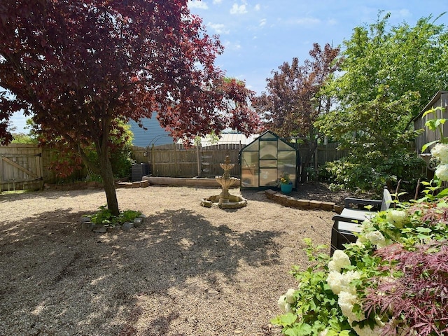 9113 Elm Cir, Hickory Hills, IL 60457 - fenced backyard with a greenhouse and an outdoor structure