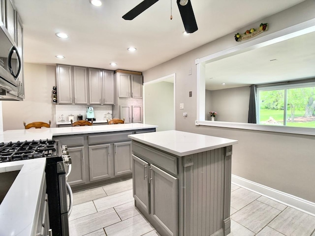 9113 Elm Cir, Hickory Hills, IL 60457 - kitchen featuring gray cabinets, ceiling fan, stainless steel appliances, light countertops, and recessed lighting