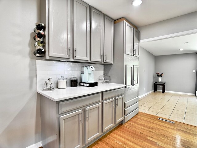9113 Elm Cir, Hickory Hills, IL 60457 - kitchen with gray cabinetry, backsplash, light countertops, and recessed lighting