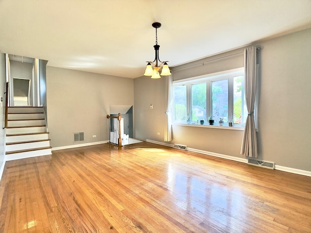 9113 Elm Cir, Hickory Hills, IL 60457 - unfurnished living room with wood finished floors, baseboards, and stairway