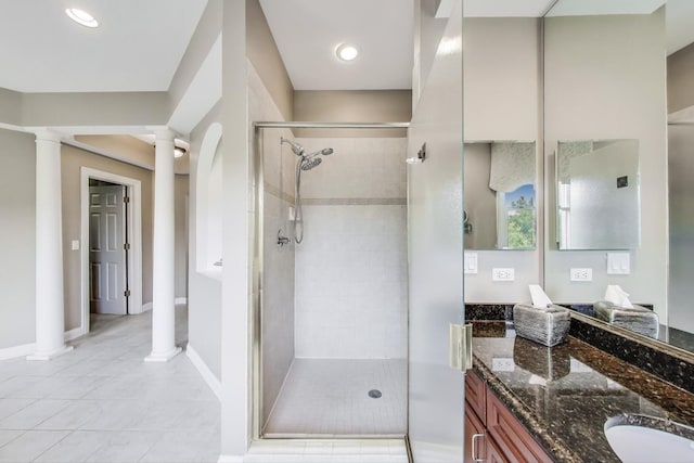 2013 Valor Ct, Glenview, IL 60026 - full bath with double vanity, a stall shower, decorative columns, and tile patterned flooring