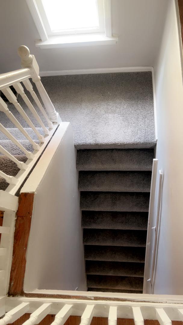 10643 S Calhoun Ave, Chicago, IL 60617 - stairway with carpet flooring