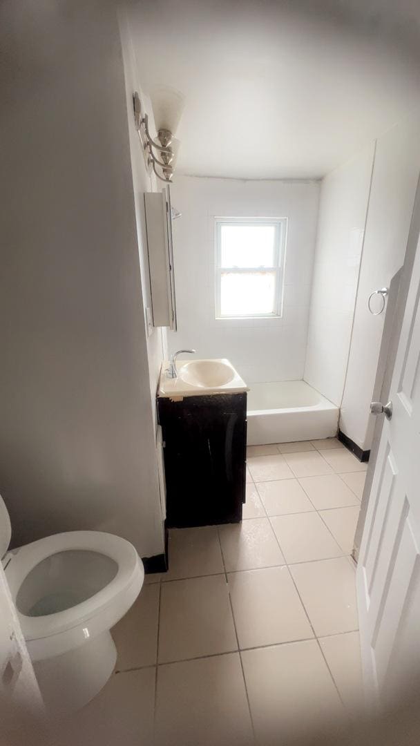 10643 S Calhoun Ave, Chicago, IL 60617 - full bath with toilet, vanity, tile patterned flooring, and a tub