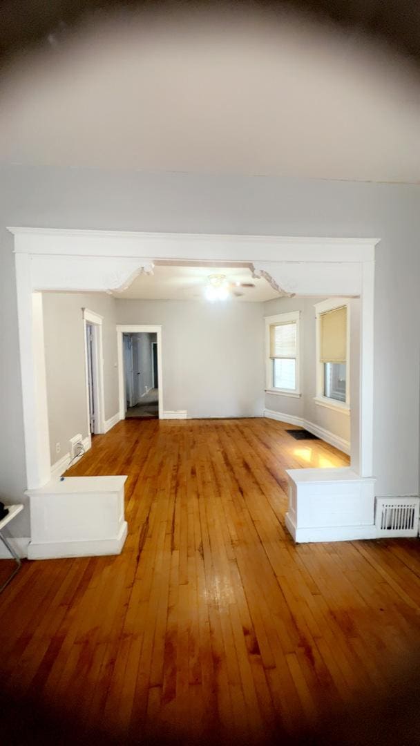 10643 S Calhoun Ave, Chicago, IL 60617 - unfurnished living room featuring hardwood / wood-style flooring