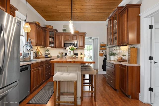 17918 Ridgewood Ave, Lansing, IL 60438 - kitchen with stainless steel appliances, a sink, wood ceiling, butcher block countertops, and a breakfast bar area
