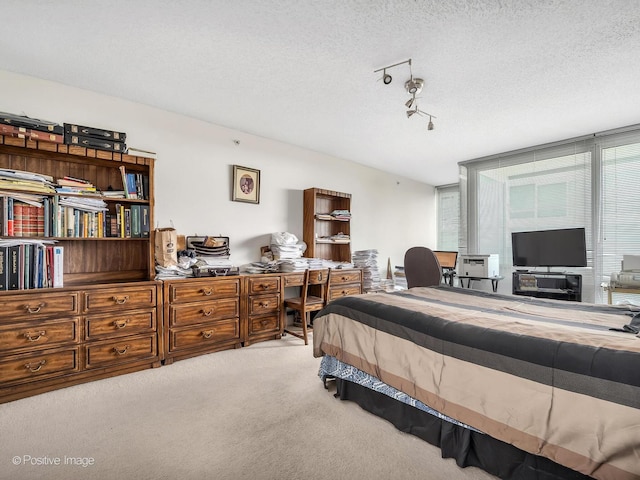 9715 Woods Dr Unit 1104, Skokie, IL 60077 - carpeted bedroom featuring a desk and a textured ceiling