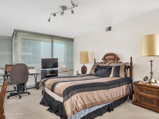 9715 Woods Dr Unit 1104, Skokie, IL 60077 - bedroom with carpet flooring, a desk, and a textured ceiling