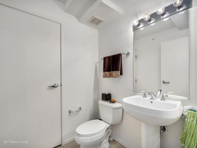 9715 Woods Dr Unit 1104, Skokie, IL 60077 - half bathroom featuring toilet, tile patterned floors, and baseboards