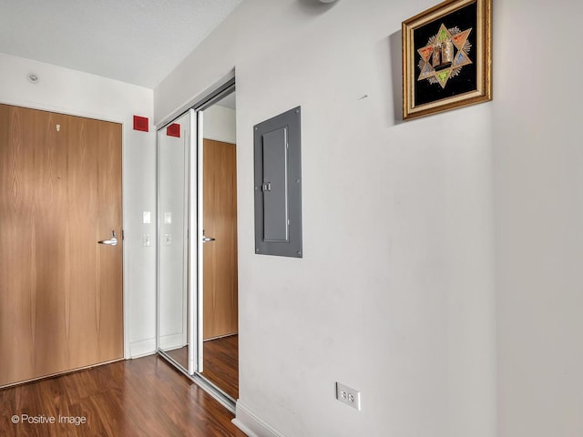 9715 Woods Dr Unit 1104, Skokie, IL 60077 - unfurnished bedroom with electric panel, dark wood-style flooring, and a closet