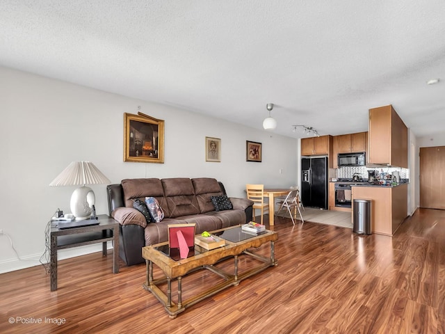 9715 Woods Dr Unit 1104, Skokie, IL 60077 - living area with light wood-type flooring and track lighting