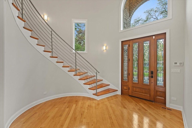 3 Crestview Ter, Buffalo Grove, IL 60089 - foyer entrance with a towering ceiling, light wood-style flooring, stairs, and baseboards
