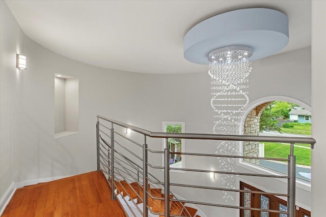 3 Crestview Ter, Buffalo Grove, IL 60089 - stairs with a chandelier, wood finished floors, and baseboards