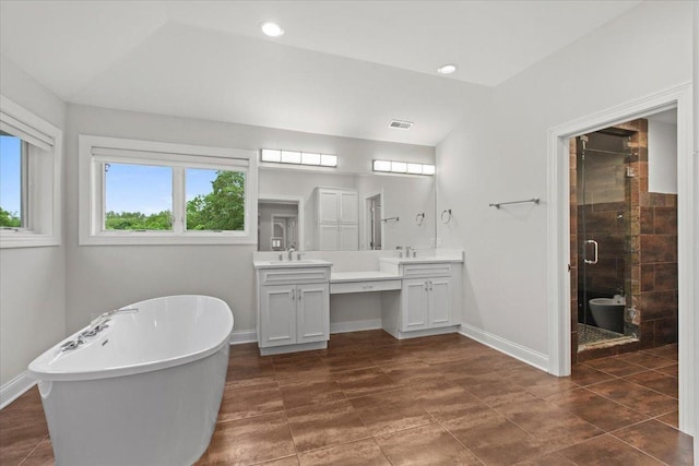 3 Crestview Ter, Buffalo Grove, IL 60089 - bathroom featuring double vanity, a stall shower, a freestanding bath, baseboards, and recessed lighting