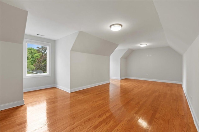 3 Crestview Ter, Buffalo Grove, IL 60089 - bonus room featuring vaulted ceiling, light wood-style floors, and baseboards