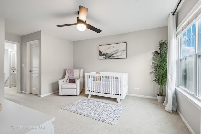 1263 Evergreen Ave, Des Plaines, IL 60016 - bedroom featuring carpet floors, baseboards, ceiling fan, and a nursery area