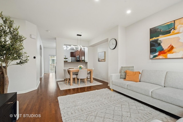 1263 Evergreen Ave, Des Plaines, IL 60016 - living room featuring dark wood-style floors, baseboards, recessed lighting, and a chandelier