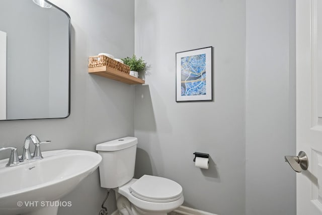 1263 Evergreen Ave, Des Plaines, IL 60016 - half bath with a sink, toilet, and baseboards