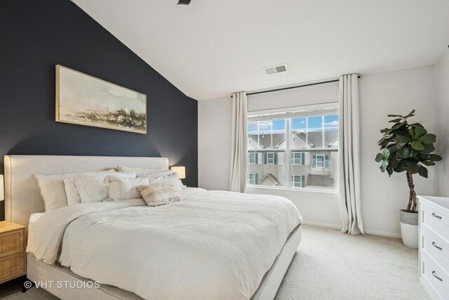 1263 Evergreen Ave, Des Plaines, IL 60016 - bedroom featuring light carpet, vaulted ceiling, and baseboards